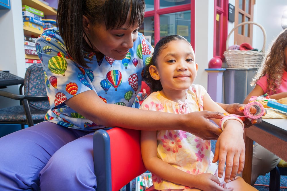 Nurse Treating a Child